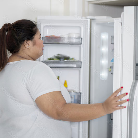 Woman looking in fridge